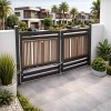 Bi-folding swing gate system installed at commercial entrance in UAE